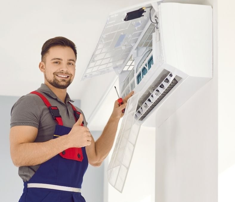 HVAC technician testing a AC after HVAC installation in Kansas City