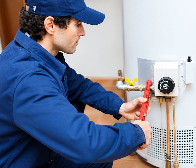 Homeowner checking after water heater installation in Kansas City