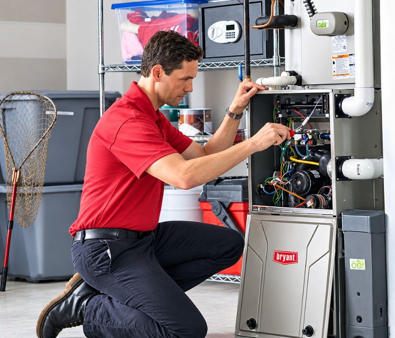 Professional technician diagnosing a furnace problem requiring heating repair in Kansas City